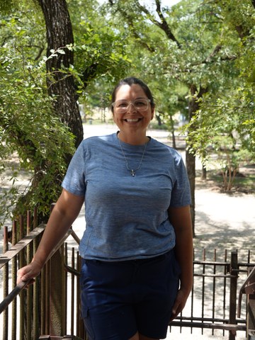 Emily Kirtner, Co-Owner and Park Manager, on the tree office steps at North Crest RV Park