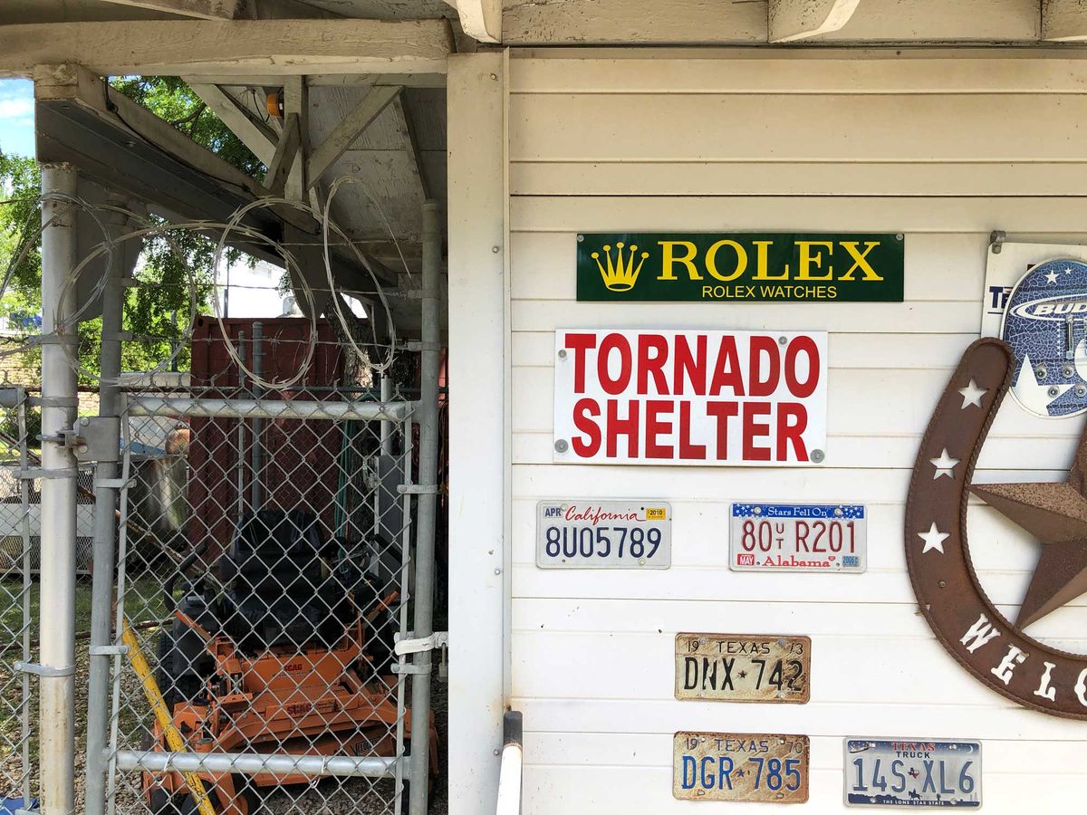 The underground storm shelter entrance with Mark's vintage license-plate collection