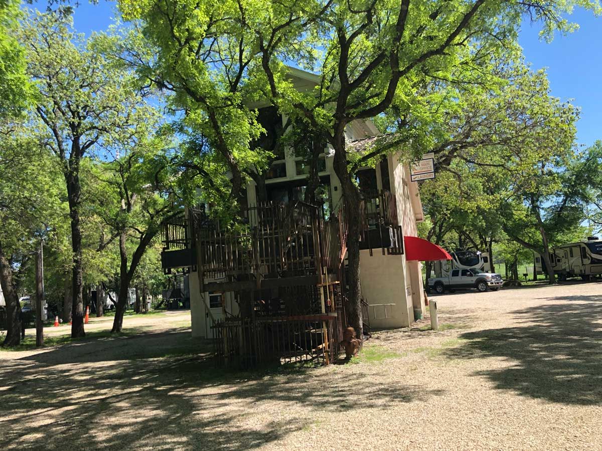 The hand-built two-story tree office wrapped around a live oak